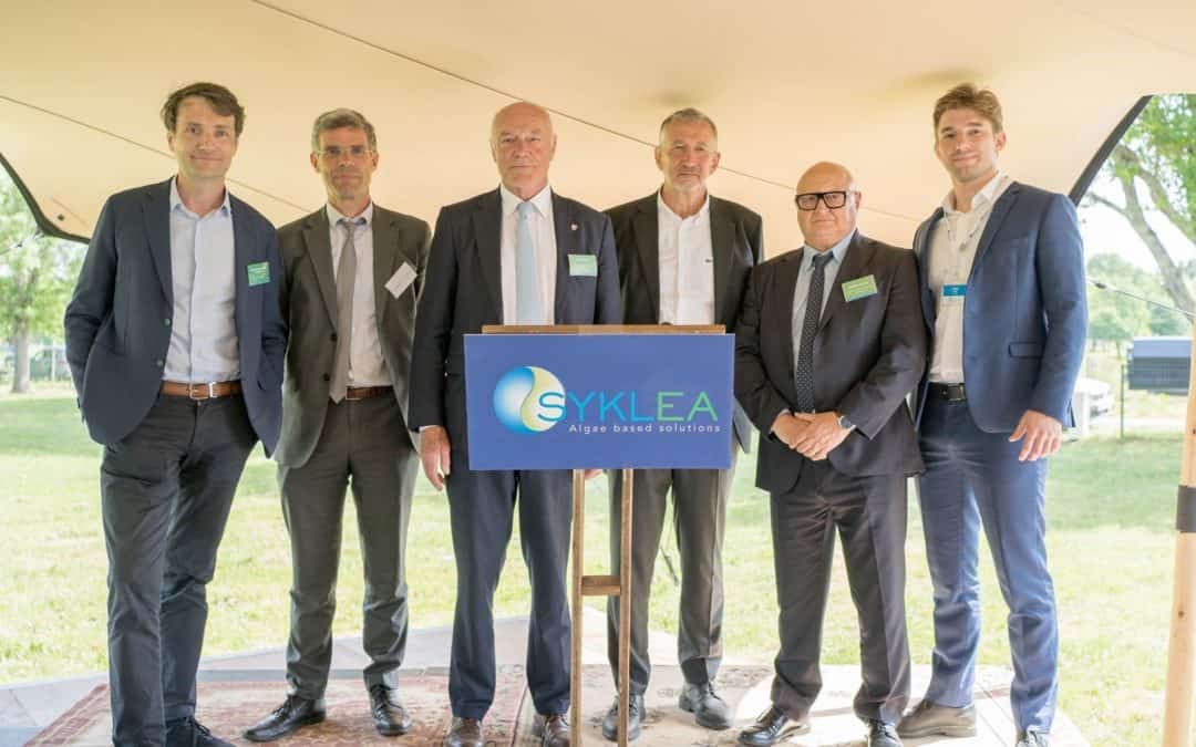 Syklea leaders at the start of the industrial phase, featuring the Syklea logo.